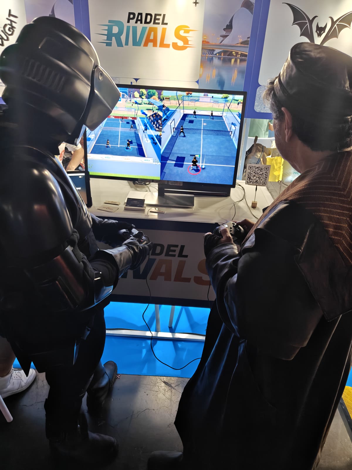 Cosplayers playing Padel Rivals at the stand during OWN Valencia 2026